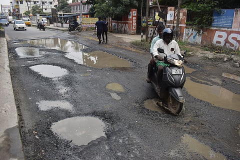 The service road below the GN Mills Flyover on Mettupalayam Road. The road which was already repaired poorly by TWAD Board, caved in and got damaged again. As a result, the Pillur 1 water supply pipeline was broken and huge amount of water got wasted. also Motorist facing harship travelling on this road.