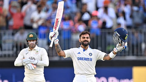 India’s Virat Kohli celebrates reaching his century (100 runs) during day three of the first Test cricket match between Australia and India at Optus Stadium in Perth on November 24, 2024.