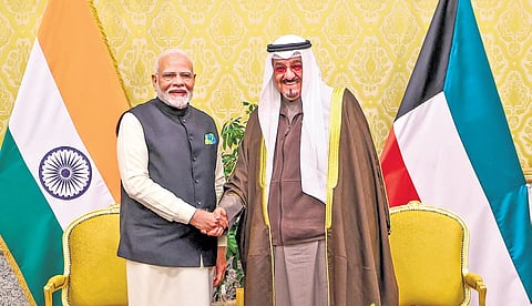 Prime Minister Narendra Modi with his Kuwaiti counterpart Sheikh Ahmed Abdullah Al-Ahmad Al-Sabah during the signing of an MoU at a meeting in Kuwait.