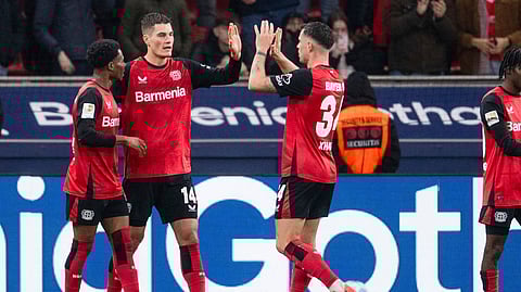 Leverkusen's Patrik Schick, second left, celebrates after scoring the opening goal during the German Bundesliga soccer match between Bayer 04 Leverkusen and SC Freiburg in Leverkusen, Germany.