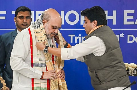 Amit Shah being felicitated by Minister for Development of North Eastern Region Jyotiraditya Scindia during the North Eastern Council in Agartala on Saturday.