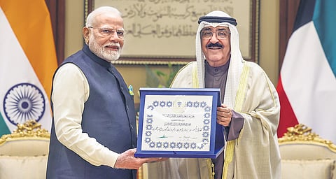 Prime Minister Narendra Modi being conferred with ‘The Order of Mubarak Al Kabeer’ by Emir of Kuwait Sheikh Meshal Al-Ahmad Al Sabah, in Kuwait on Sunday.