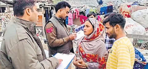 Delhi Police personnel during a campaign to identify Bangladeshi and Rohingya immigrants residing without valid documentation, in Delhi on Tuesday