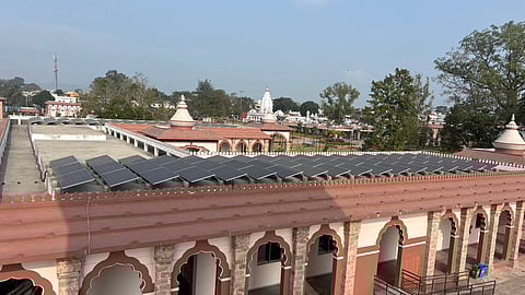 Solar panels installed on the roof of the temple complex.