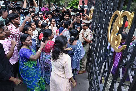 Members of SFI stage a demonstration on the gate of Anna University campus after a students was allegedy raped inside the campus.