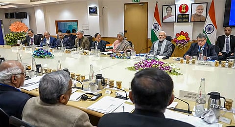 Prime Minister Narendra Modi chairs a NITI Aayog meeting with economists, Tuesday, Dec. 24, 2024. Union Finance Minister Nirmala Sitharaman is also seen.