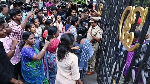 Members of SFI stage a demonstration on the gate of Anna University campus after a student was allegedly raped inside the campus.