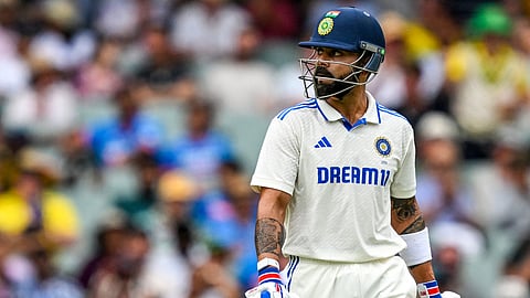 Virat Kohli walks back to the pavilion after his dismissal on the first day of the second Test cricket match between Australia and India in Adelaide.