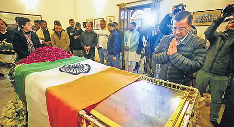 AAP chief Arvind Kejriwal pays tribute to the mortal remains of former PM Manmohan Singh in New Delhi on Friday
