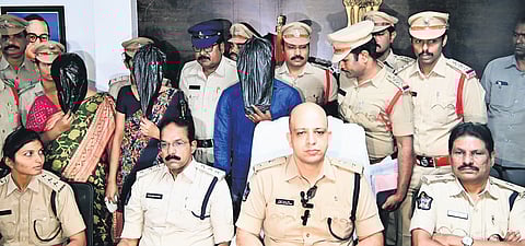 The police with the accused.