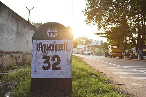 Vehicles plying on the Siruvani road at outskirts of Coimbatore on Friday. .