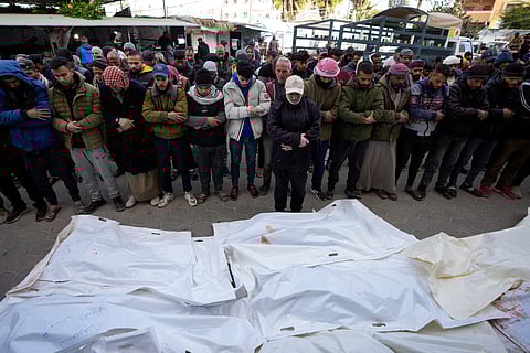 Palestinians attend funeral prayers over the bodies of those killed in overnight Israeli airstrikes on the Maghazi refugee camp, at Al-Aqsa Hospital, in Deir al-Balah, central Gaza Strip, Saturday, Dec. 28, 2024.