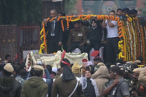 The mortal remains of former prime minister Manmohan Singh being brought to the Nigambodh Ghat for his last rites, in New Delhi, Saturday, Dec. 28, 2024.