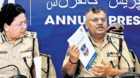 Telangana DGP Dr Jitender releases the Telangana Police Annual Report 2024 during a press conference at the DGP office in Hyderabad on Sunday.