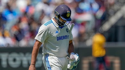 Rohit Sharma walks off the field after losing his wicket during play on the last day of the fourth cricket test between Australia and India.
