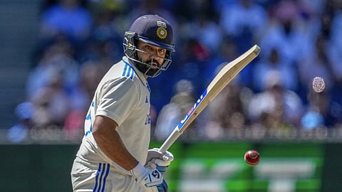 Rohit Sharma watches the ball after playing a shot during play on the last day of the fourth cricket test between Australia and India at the Melbourne Cricket Ground, Melbourne, Australia, Monday, Dec. 30, 2024.