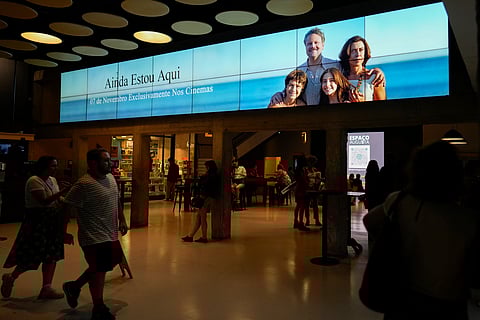 People wait to watch the film "I'm Still Here," at a movie theater in Sao Paulo.