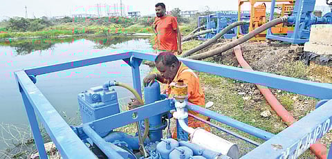 Workers pumping out water accumulated at iconic buildings site in Amaravati