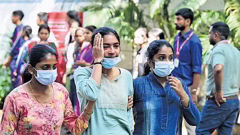 Students weep as they reach St.Alberts College, where the bodies were kept for the public to pay homage, on Wednesday.
