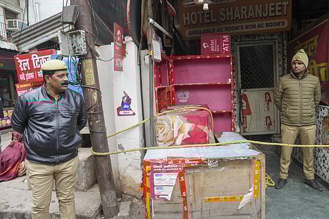 Police personnel during an investigation after five members of a family were found dead at a hotel, in Lucknow, Wednesday, Jan. 1, 2025.