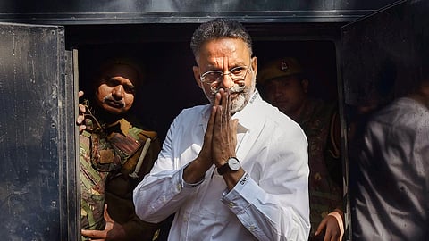In this March 28, 2024 photo, the late gangster-turned-politician Mukhtar Ansari is seen being presented at a district court in Prayagraj, Uttar Pradesh.