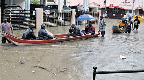 Residents being moved to safety in boat during October rains last year.