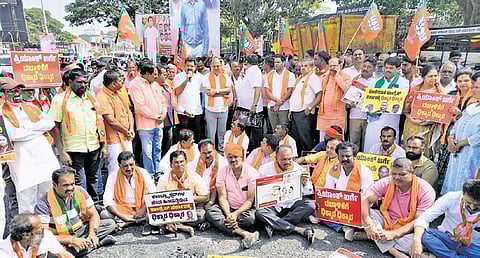 BJP members stage a protest against minister Priyank Kharge in Mandya on Thurday