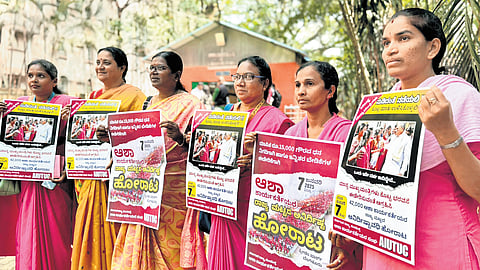 Demanding fixed wages and incentives, ASHA workers protest at Freedom Park in Bengaluru on Thursday