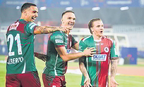 MBSG’s Jason Steven Cummings rejoices after scoring on Thursday.