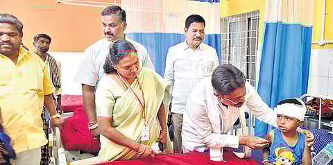 MLA SN Narayanaswamy speaks with an injured student at a hospital in Bangarpet on Saturday