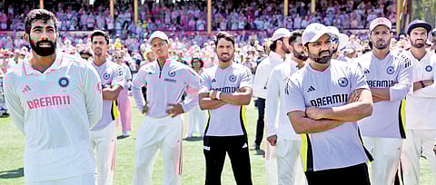 Jasprit Bumrah and Rohit Sharma (foreground) during the presentation ceremony after the fifth and final Test of the BGT in Sydney, on Sunday.