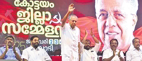 Chief Minister Pinarayi Vijayan greets party workers at Pampady in Kottayam on Sunday during the public meeting held as part of CPM district conference