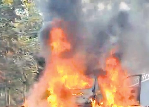 Two persons were burnt alive after their car caught fire near Ghatkesar on Monday