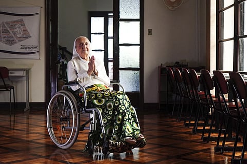 In this photo released by LongeviQuest, Sister Inah Canabarro, 115 puts her hands together in prayer, in Porto Alegre, Brazil, Friday, February 16, 2024.