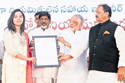 Deputy Chief Minister Mallu Bhatti Vikramarka hands over an appointment letter to a newly recruited assistant engineer of TGGENCO in Hyderabad on Monday