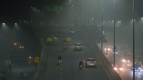 Vehicles ply on road amid fog, in New Delhi, Saturday, Jan. 4, 2024.