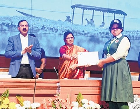 Parida felicitating a student at the Chilika Bird Festival on Monday