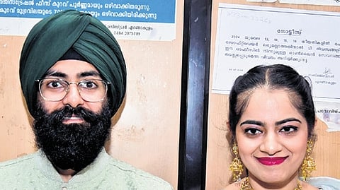 Mantej Singh and Inderpreet Kaur at the sub-registrar office in Kochi on Monday