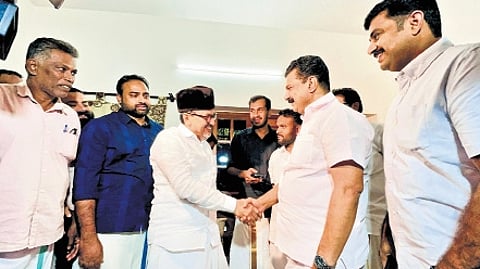 P V Anvar greeting Sadiq Ali Shihab Thangal at his residence in Panakkad on Tuesday