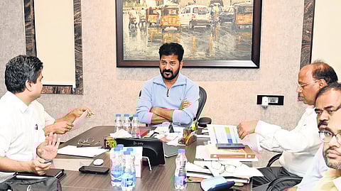 Chief Minister A Revanth Reddy chairs a review meeting with officials on Metro extension, elevated corridors and radial roads, at his residence on Tuesday