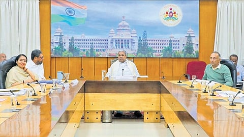 Chief Minister Siddaramaiah, Health Minister Dinesh Gundu Rao, Chief Secretary Shalini Rajneesh and officials at a review meeting on the progress of the Social Welfare Department, at the CM’s home office Krishna in Bengaluru on Tuesday