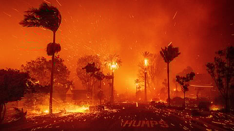 The Palisades Fire ravages a neighborhood amid high winds in the Pacific Palisades neighborhood of Los Angeles, Tuesday, Jan. 7, 2025