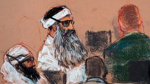 Drawing by artist Janet Hamlin and reviewed by the U.S. military, shows Khalid Sheikh Mohammed, center, and co-defendant Walid Bin Attash, left, attending a pre-trial session at Guantanamo Bay Naval Base, Cuba.