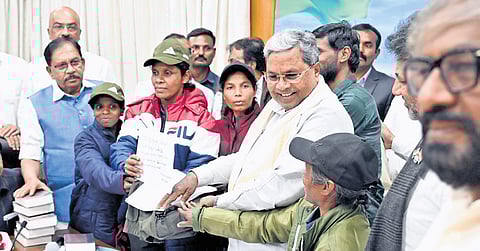 CM Siddaramaiah interacts with the six Naxals who surrendered in his presence in Bengaluru on Wednesday.