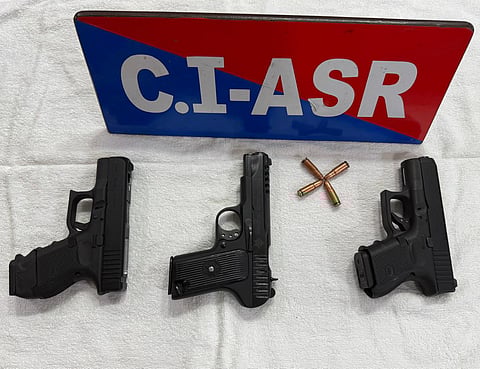 The three pistols and cartridges seized from Gurpreet Singh alias Kaka, who was arrested by the Punjab police on Thursday.