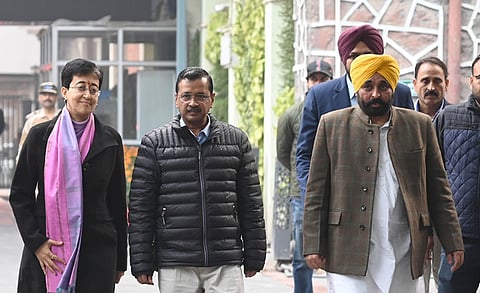 Delhi Chief Minister Atishi with Punjab CM Bhagwant Mann and AAP National Convenor Arvind Kejriwal.