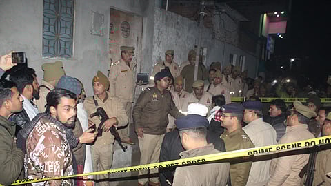 Police personnel conduct an investigation after at least five members of a family were found dead at their residence in Meerut, Uttar Pradesh, Friday, Jan. 10, 2025.