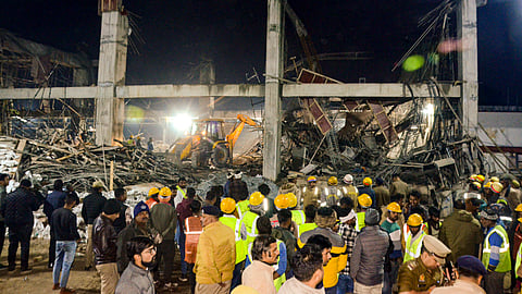 Rescue operation underway after an under-construction building collapsed at the Kannauj railway station, trapping around two dozen workers under the rubble, in Kannauj in Uttar Pradesh