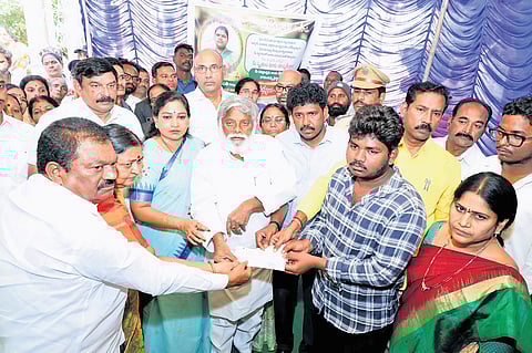 Home Minister Vangalapudi Anitha hands over ex gratia to the families of Tirupati stampede victims in Visakhapatnam on Sunday