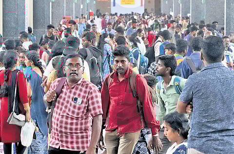 Kilambakkam bus terminus bustling with activity as people arrive to take buses for their home towns to celebrate Pongal festival